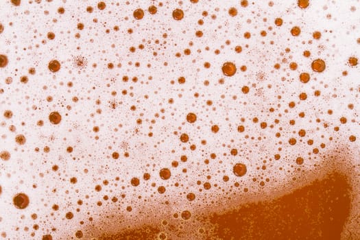 Macro view of beer foam, top view.