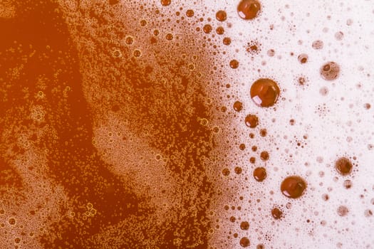Macro view of beer foam, top view.