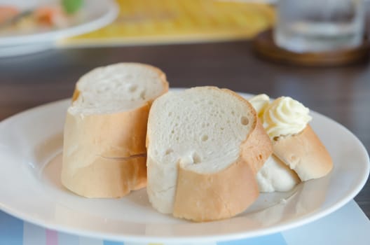 close up  slice of bread on white dish with delicious cheese