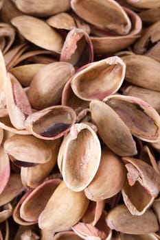 Heap of pistachio nutshells background.