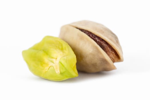 Pistachio nuts, isolated on white background.