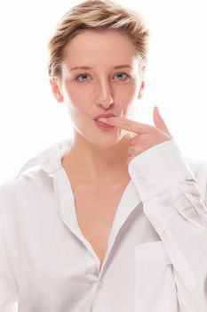 young blonde woman sucking her finger on white background