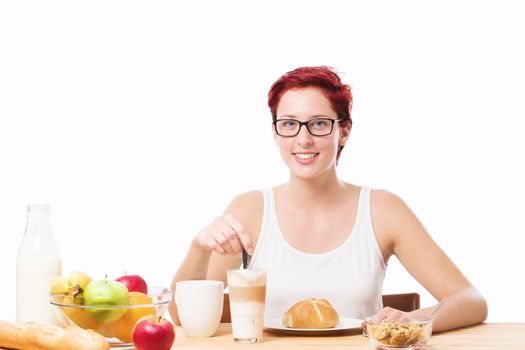 happy woman at breakfast with a latte macchiato coffee on white background