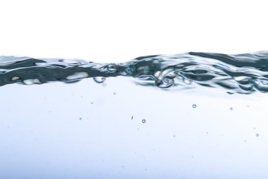 Close up view of water splash with big bubbles, isolated on white background.