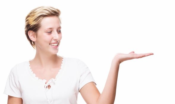 happy woman showing empty hand for product placement on white background