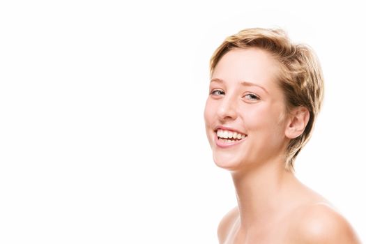 portrait of a laughing young woman on white background