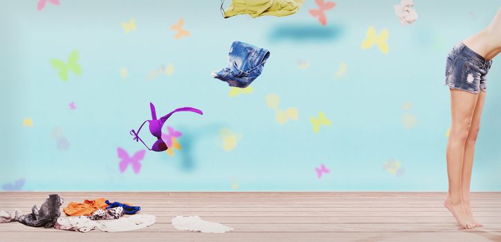 woman throwing clothes from wardrobe to the floor in sixties style