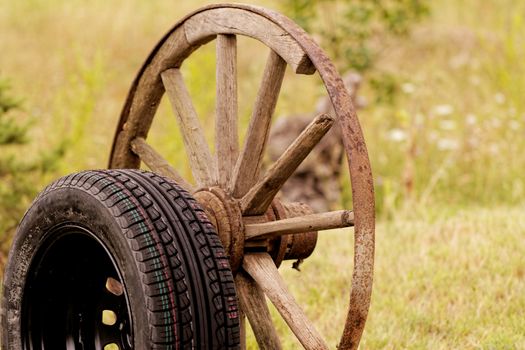 new and old broken wagon (car) wheel