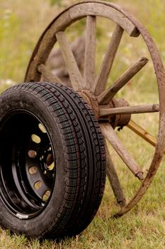 new and old broken wagon (car) wheel