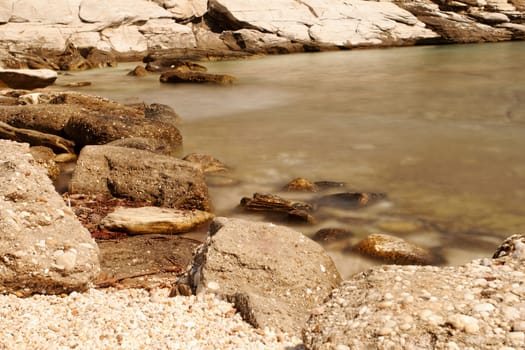 rocky beach with turquoise sea in greece thassos island