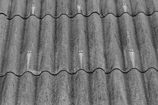 monochrome texture of gray corrugated slate roof