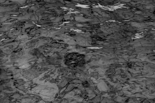 grey abstract background of wavy water surface