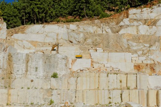 Detail of huge Thassos white marble quarry (mine) with grabber