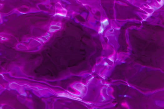 purple abstract background of wavy water surface (lilac)