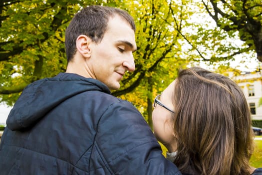 Back View Of Romantic Couple In Autumn Landscape