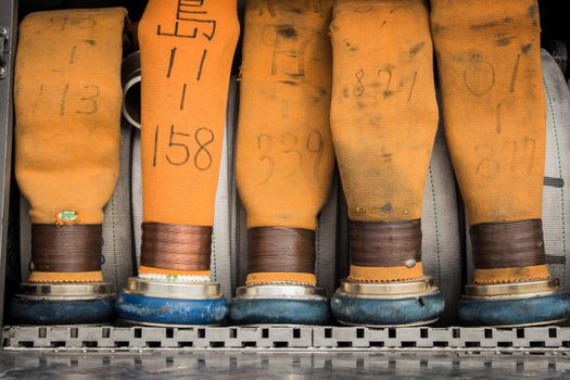 Yellow fire hoses on a fire truck