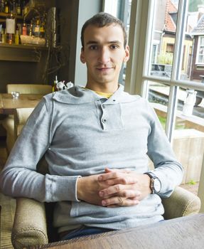 Portrait of smiling handsome man indoors