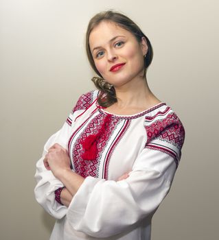 Portrait of beautiful young woman in the Ukrainian national clothes