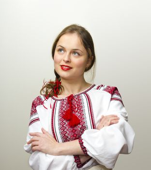 Portrait of beautiful young woman in the Ukrainian national clothes