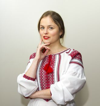 Portrait of beautiful young woman in the Ukrainian national clothes