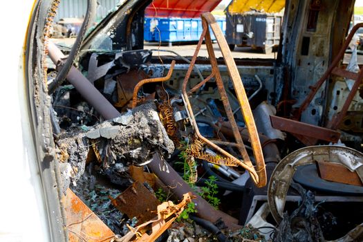 Detail of a vehicle at the auto salvage yard after a major accident collision.