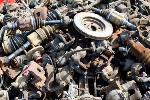 Abstract background color image of pieces at a junkyard auto salvage yard.