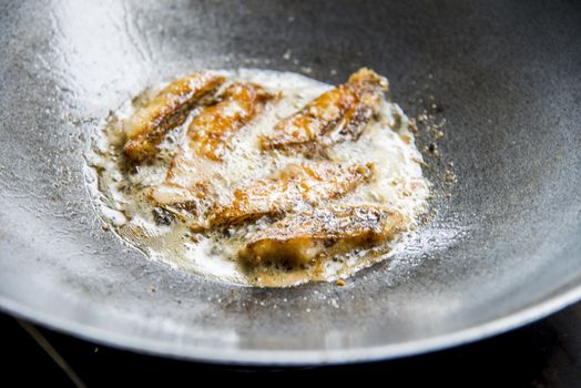 Fried pieces of fish in a pan3