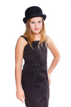 Beautiful girl wearing black dress and bowler hat in studio. Isolated on white backround.