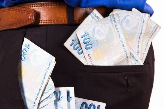 Consumer concept, one hundred Turkish lira banknotes in the pocket of businessman.