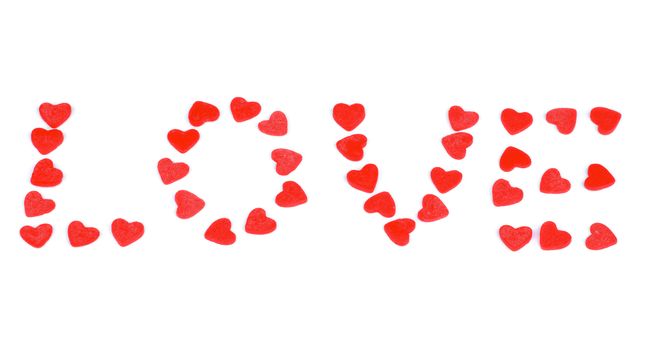 Red Sweet Shape Hearts Laid out Word Love isolated on white background