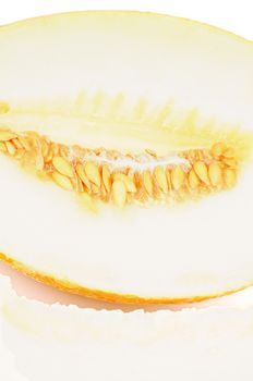 Half of Delicious Ripe Cantaloupe Honeydew Melon and Slice closeup