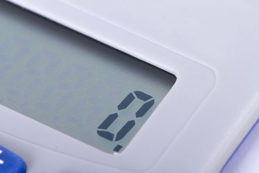 Close up view of calculator screen, zero number.