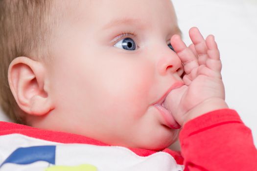 Six months old baby sucking thumb - teething