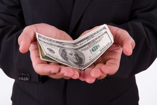 Businessman dark jacket, holding money, hundred of dollars.
