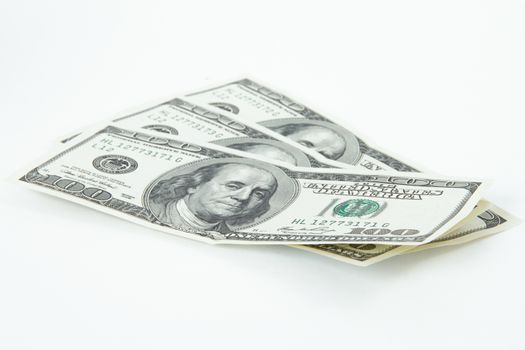 One hundred dollar bills, isolated on white background.