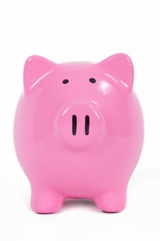 Pink piggy bank front view, isolated on white background.