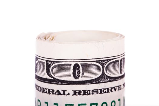 Roll of one hundred dollar banknotes, isolated on white background.