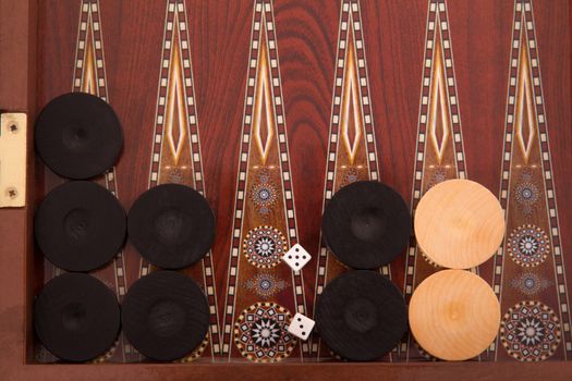 Backgammon chips and dices, top view.