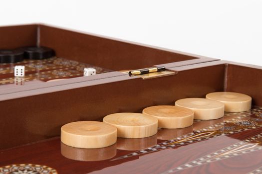 Backgammon table, chips and dices, isolated on white.