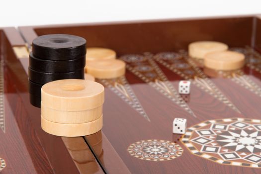 Backgammon chips and dice on table.