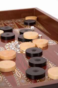 Complicated backgammon chips and dices with six and five.