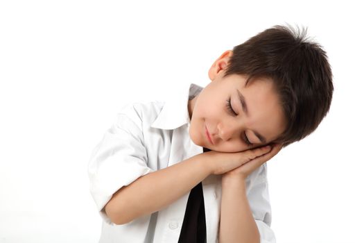 Young boy in studio acting sleeping