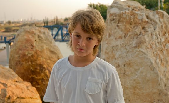 Portrait of a boy on the background of Jerusalem stone.