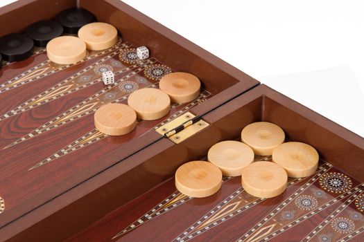 Backgammon table, chips and dices, isolated on white.