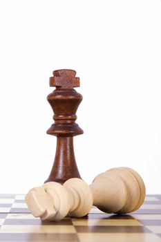 Victory, dark king defeats light king, isolated on white background.