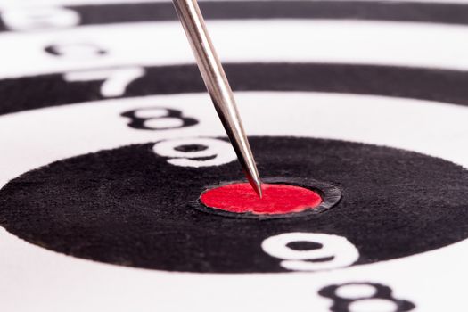 Arrow in the middle of dart board.