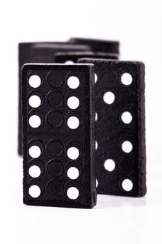 Dominoes pieces in a row, isolated on white background.