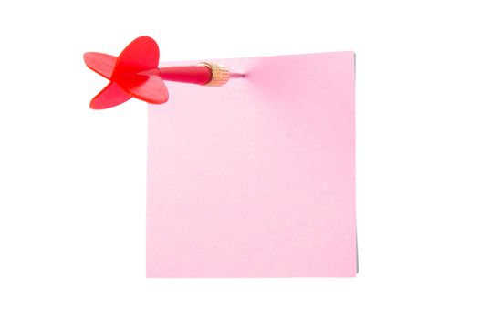 Red, plastic dart arrow and pink sticky post it note, isolated on white background.