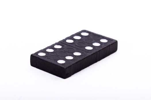 Single black domino, isolated on white background.