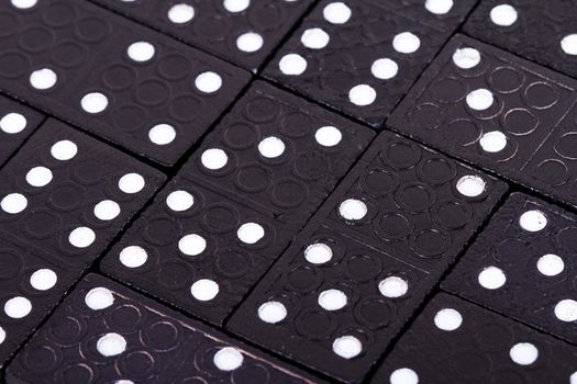 Full view of dominoes pieces in a row.